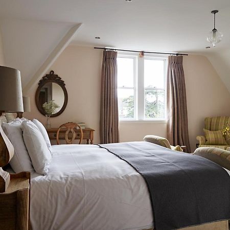 Bed and Breakfast Cotswold Grange Челтнем Екстер'єр фото A bedroom at The Pig
